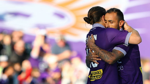 Perth Glory's Josh Risdon and Diego Castro embrace after beating Wellington.
