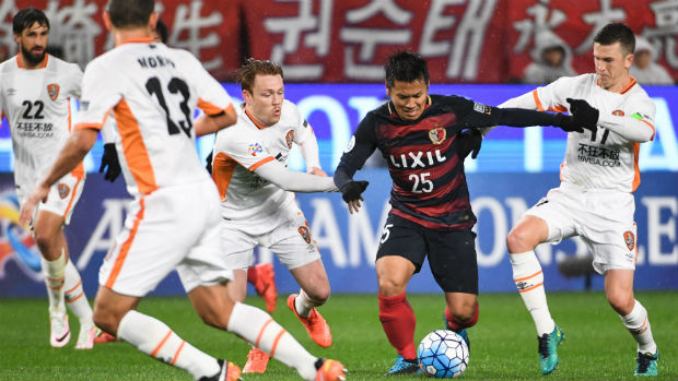 Kashima Antlers' Yasushi Endo tries to evade Brisbane Roar's defence in the ACL on Tuesday night.
