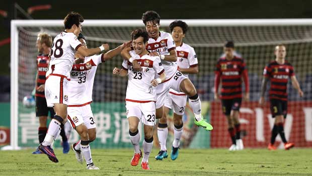 FC Seoul players celebrate their opening goal in the ACL clash against Western Sydney Wanderers in Campbelltown on Tuesday night.