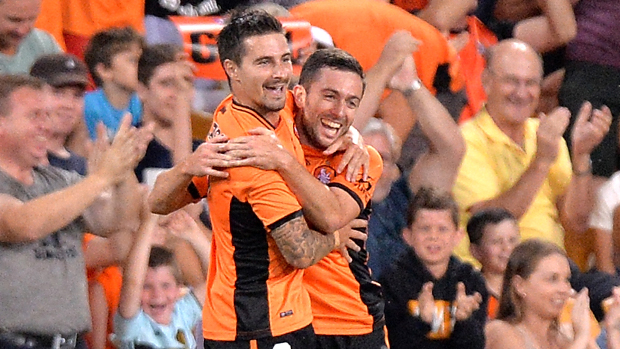 Jamie Maclaren celebrates with Tommy Oar after scoring against Melbourne City at Suncorp Stadium.