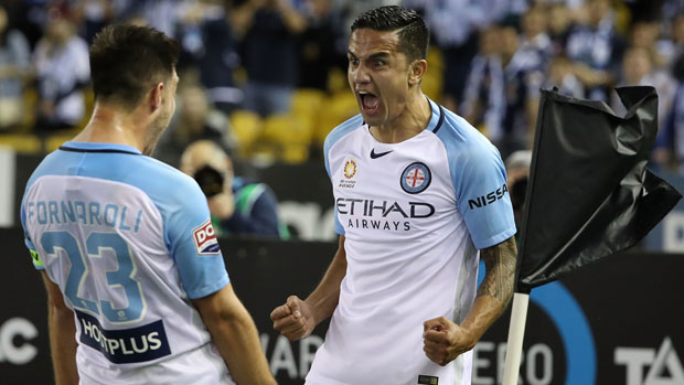 Tim Cahill celebrates with Bruno Fornaroli after scoring against Melbourne Victory.