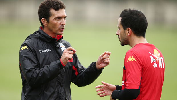 Reds boss Guillermo Amor gives instructions to Sergio Cirio during a training session.