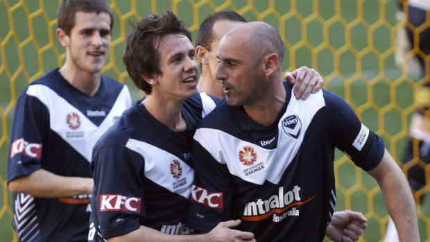 Victory coach Kevin Muscat alongside his former teammate Robbie Kruse in 2010.