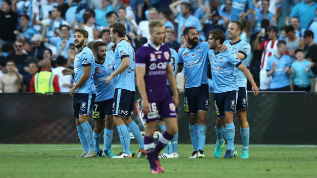 Sydney FC players celebrate one of their goals against Perth Glory on Sunday.