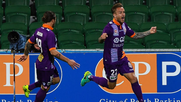 Glory striker Adam Taggart celebrates one of his two goals against the Mariners.