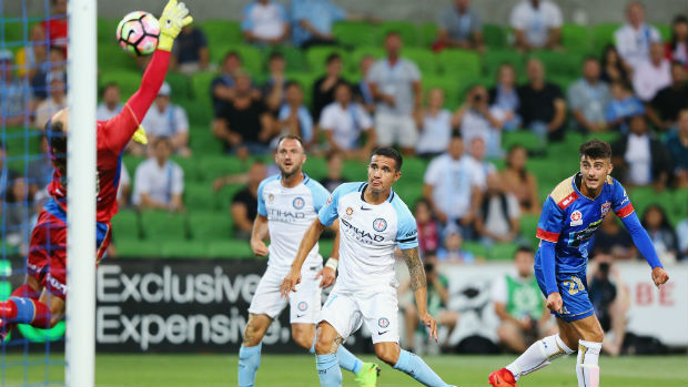 City striker Tim Cahill opens the scoring against the Jets with a header on Saturday night.