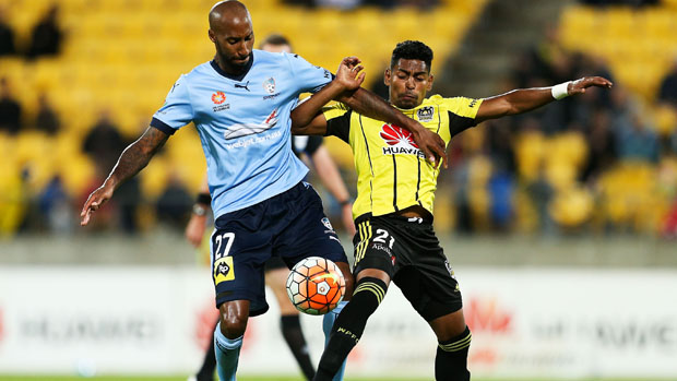 Mickael Tavares fights for the ball with Phoenix striker Roy Krishna.