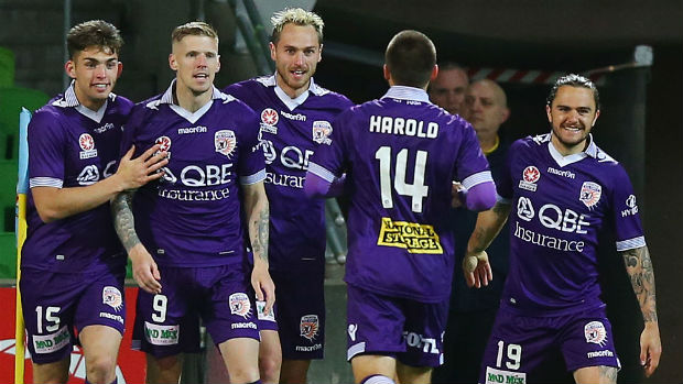 Perth Glory players celebrate opening the scoring against City at AAMI Park.