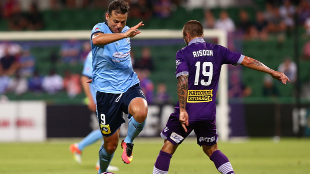 Sydney FC striker Bobo wins the ball ahead of Glory defender Josh Risdon.