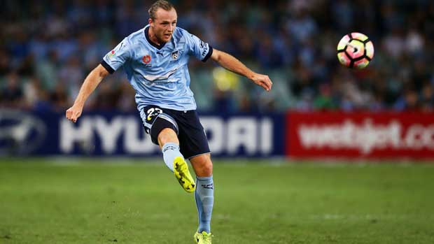 Sydney defender Rhyan Grant gets a cross in during the clash with Melbourne City on Saturday night.