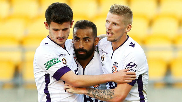 Mitch Oxborrow, Diego Castro and Andy Keogh celebrate Perth's second goal against the Phoenix on Sunday.
