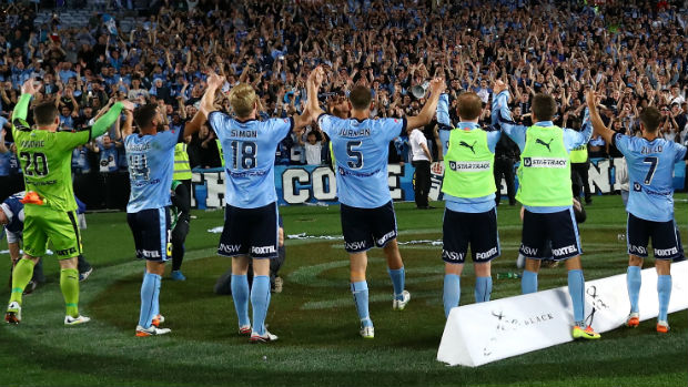 Sydney FC players celebrate their win over the Wanderers with their home fans.