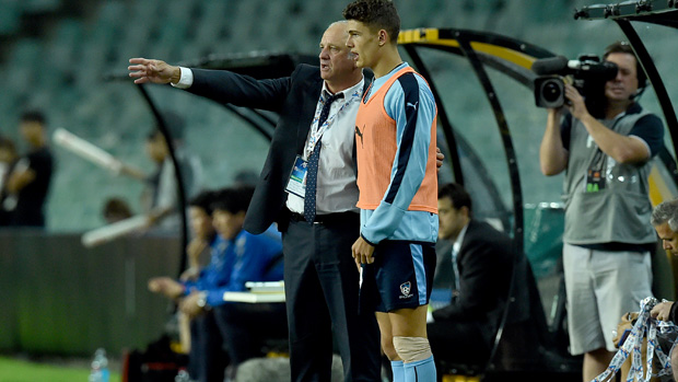 Graham Arnold gives instructions to young striker George Blackwood.