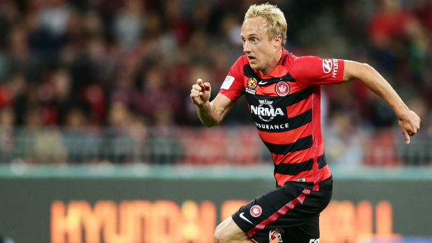 Wanderers midfielder Mitch Nichols charges onto the ball at Spotless Stadium.