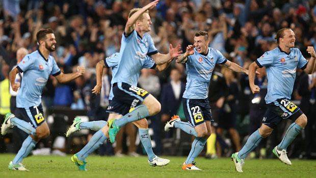 Sydney FC players celebrate their Grand Final win over Melbourne Victory.