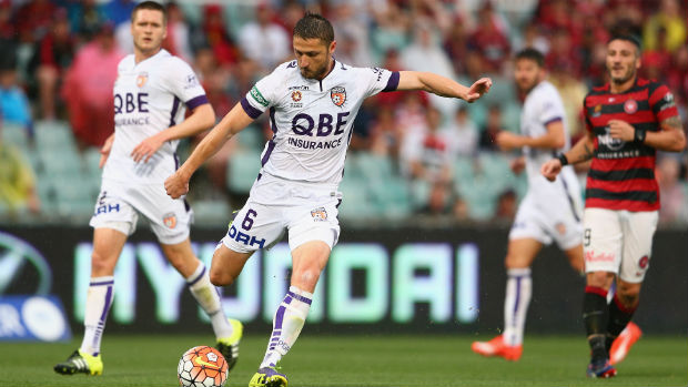 Glory defender Dino Djulbic takes a shot against the Wanderers.