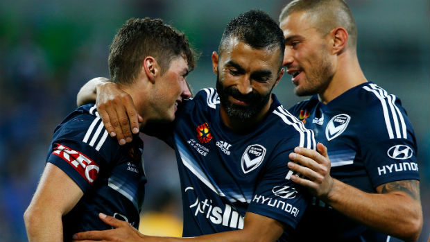 Victory's Marco Rojas, Fahid Ben Khalfallah and James Troisi celebrate a goal against Glory on Saturday night.