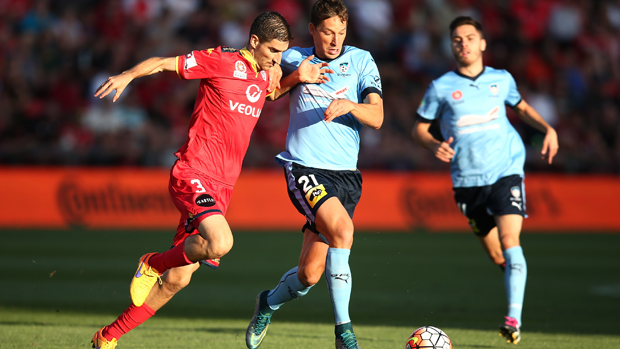 Reds midfielder Iacopo La Rocca challenges for the ball with Sky Blues forward Filip Holosko.