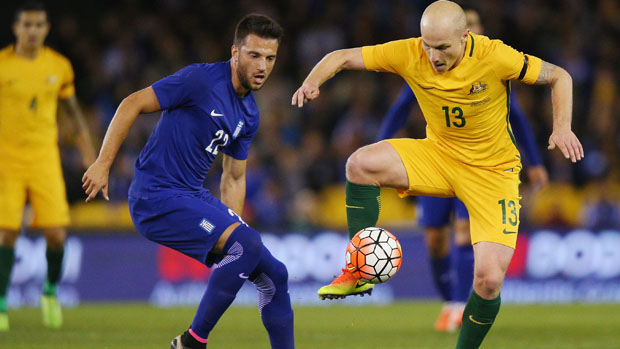 Aaron Mooy controls the ball during Australia's 2-1 loss to Greece in Melbourne.