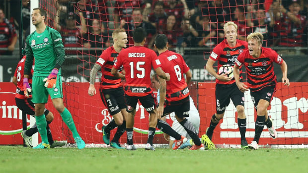 Wanderers players celebrate their late equaliser against Melbourne City.
