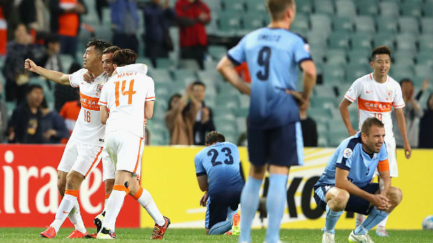 Despondent Sydney FC players react after Shandong scored a late equaliser in the ACL.