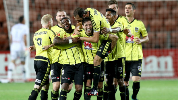 Phoenix players celebrate Vince Lia's goal against the Mariners.