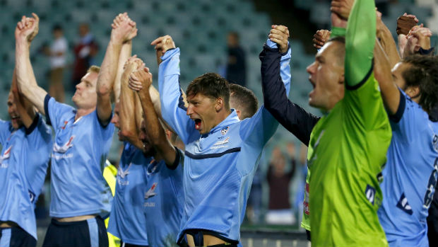 Sydney FC players celebrate their win over Melbourne Victory in Friday night's Big Blue.