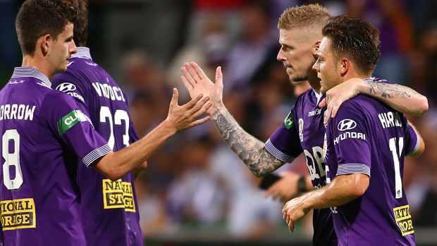 Glory players celebrate a goal in their 4-0 win over Central Coast Mariners in Round 23.