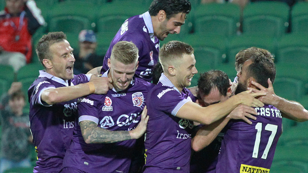 Perth Glory celebrate a goal in their 3-1 win over Brisbane Roar.