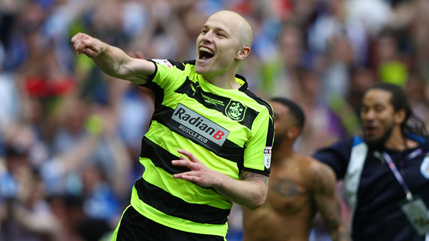 Aaron Mooy celebrates after Huddersfield's win over Reading.