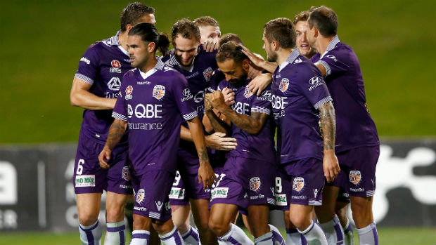 Perth Glory players celebrate Diego Castro's superlative equaliser against the Phoenix on Saturday.