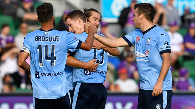 Sydney FC players celebrate a goal in their 3-0 win over Perth Glory.
