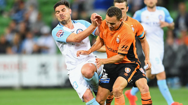 Bruno Fornaroli challenges for the ball with Roar defender Jade North.
