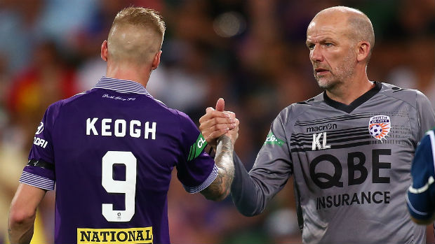 Perth Glory coach Kenny Lowe congratulates striker Andy Keogh.