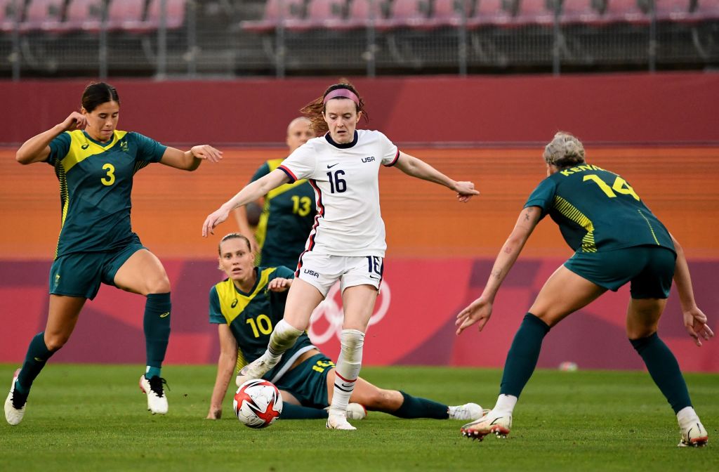 Cooney-Cross (left) closes in on United States forward Rose Lavelle