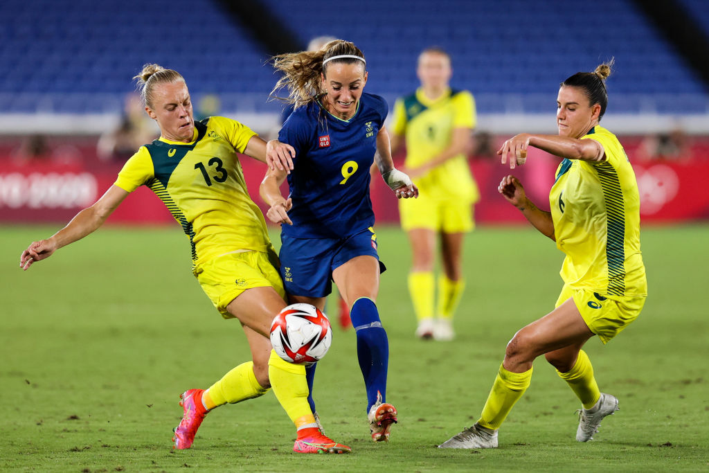 Yallop challenges Kosovare Asllani for possession in Australia's Semi Final bout with Sweden